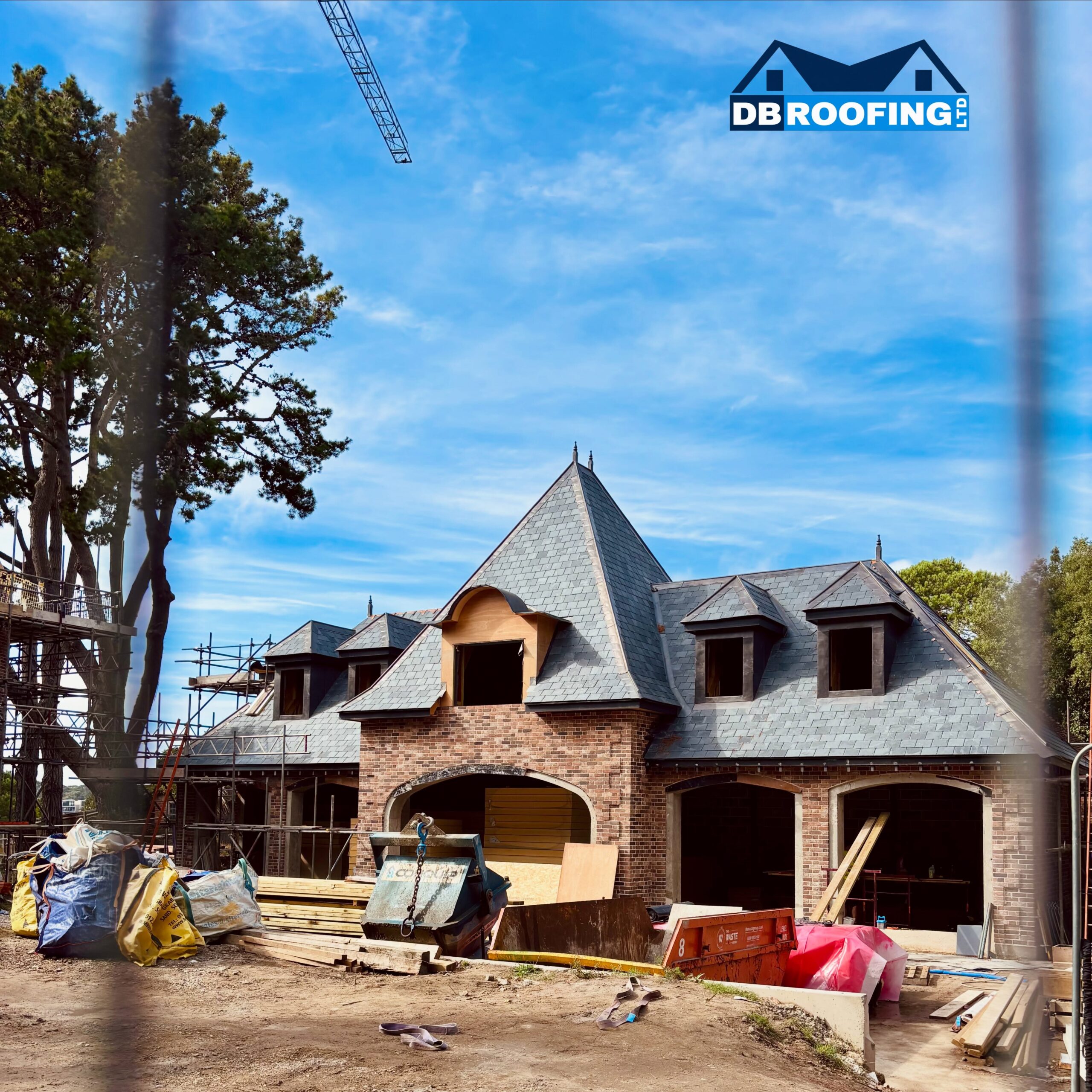 Roofer completing a roof tile repair in Dorset